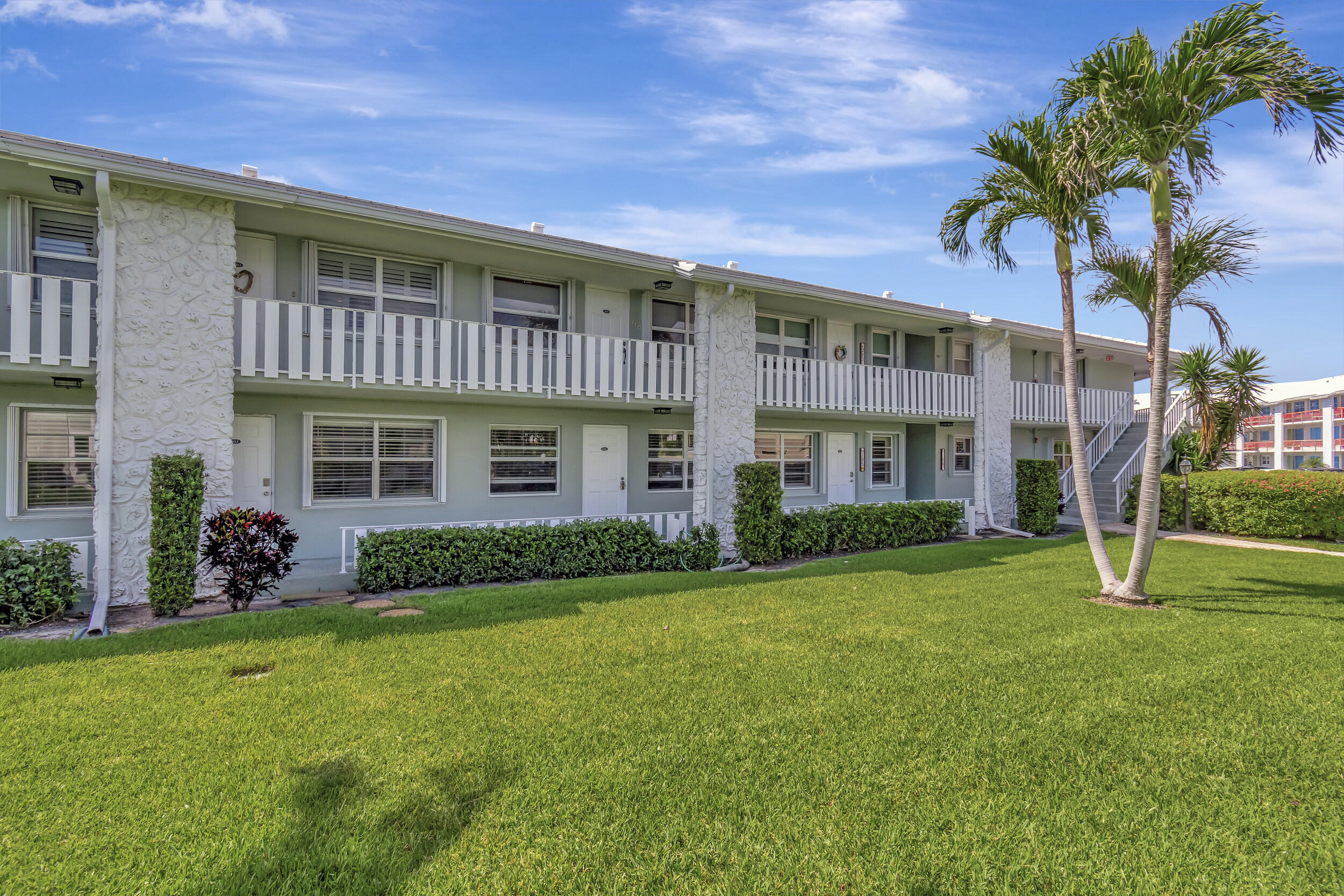 5540 North Ocean Boulevard, Unit 204 Ocean Ridge, FL 33435 - Photo 3 of 52 a view of a house with a yard
