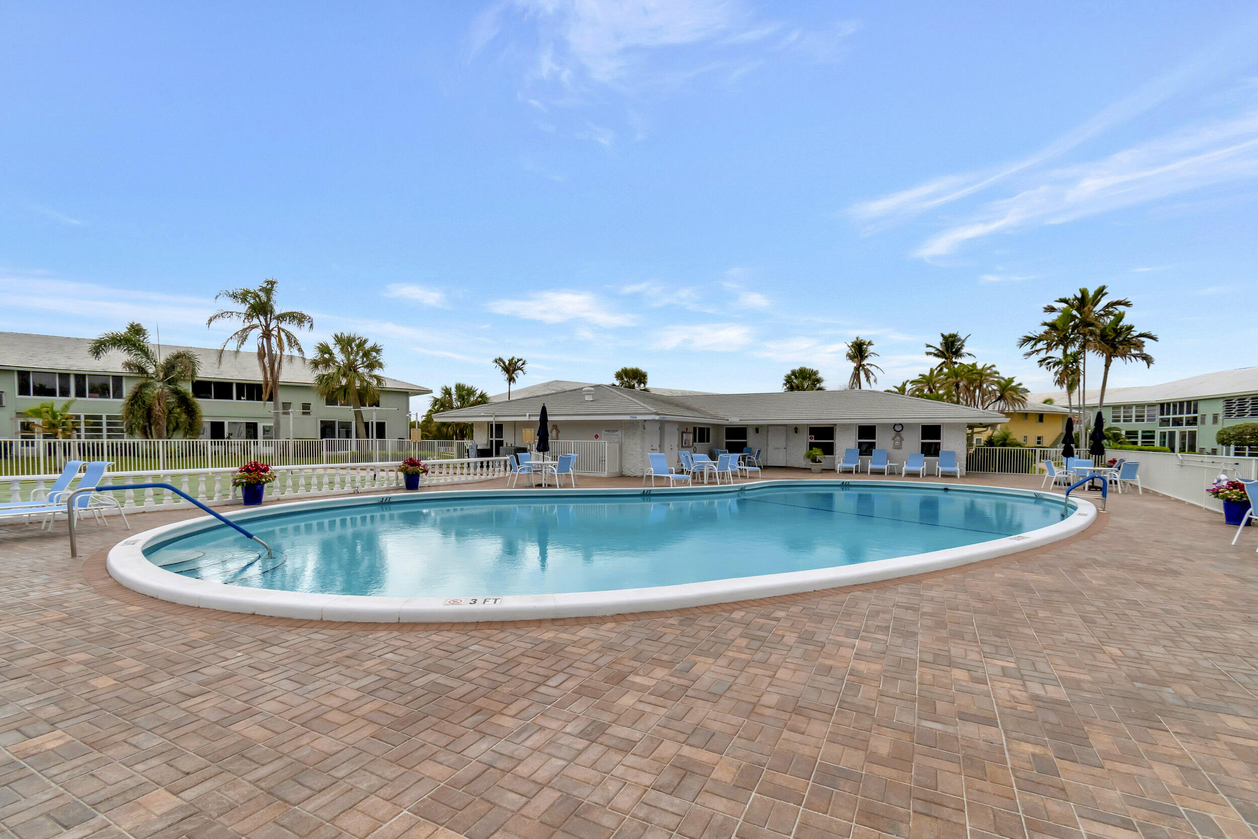 5540 North Ocean Boulevard, Unit 204 Ocean Ridge, FL 33435 - Photo 39 of 52 a view of a swimming pool with an outdoor seating