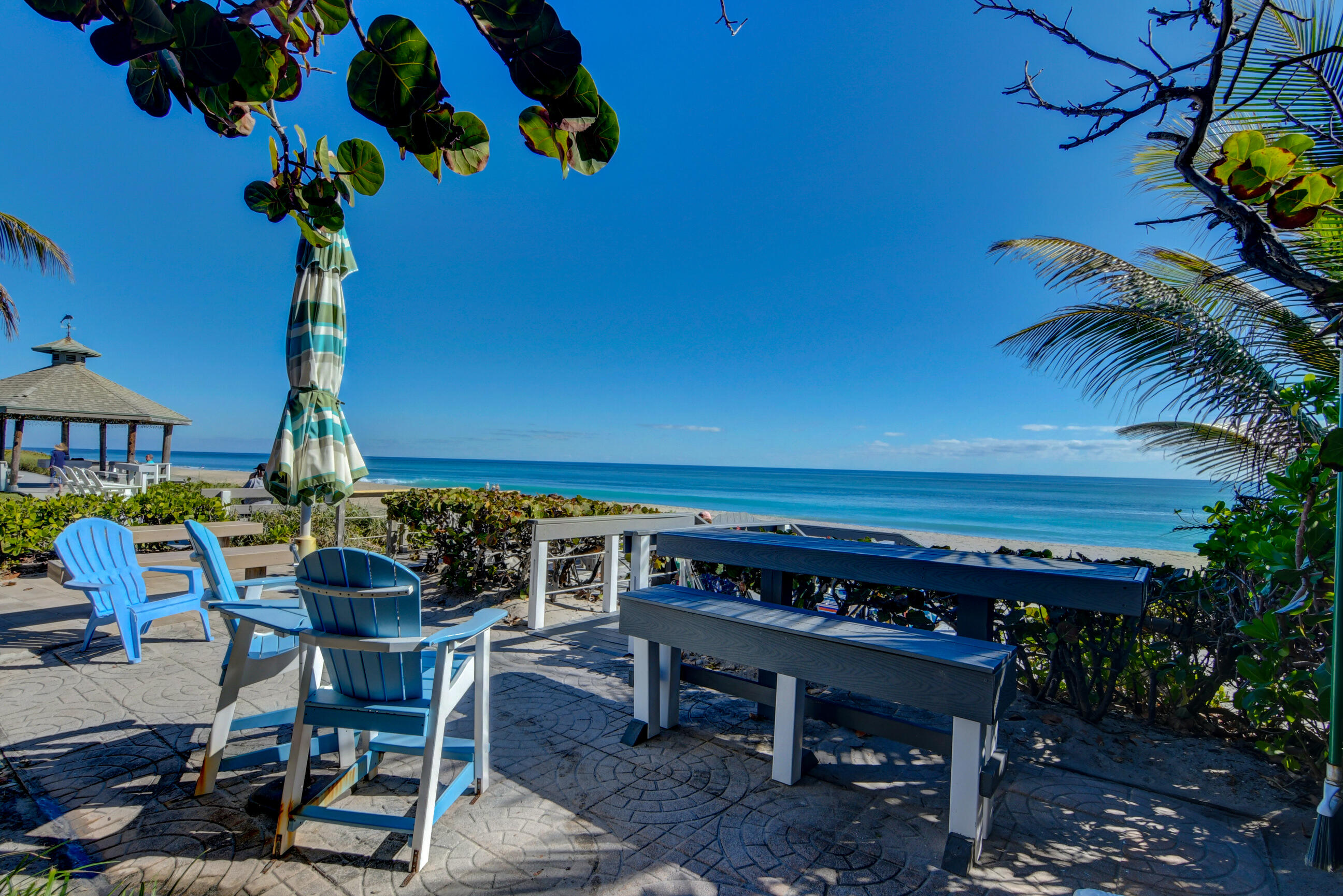 5540 North Ocean Boulevard, Unit 204 Ocean Ridge, FL 33435 - Photo 47 of 52 a view of a chairs and tables in the patio