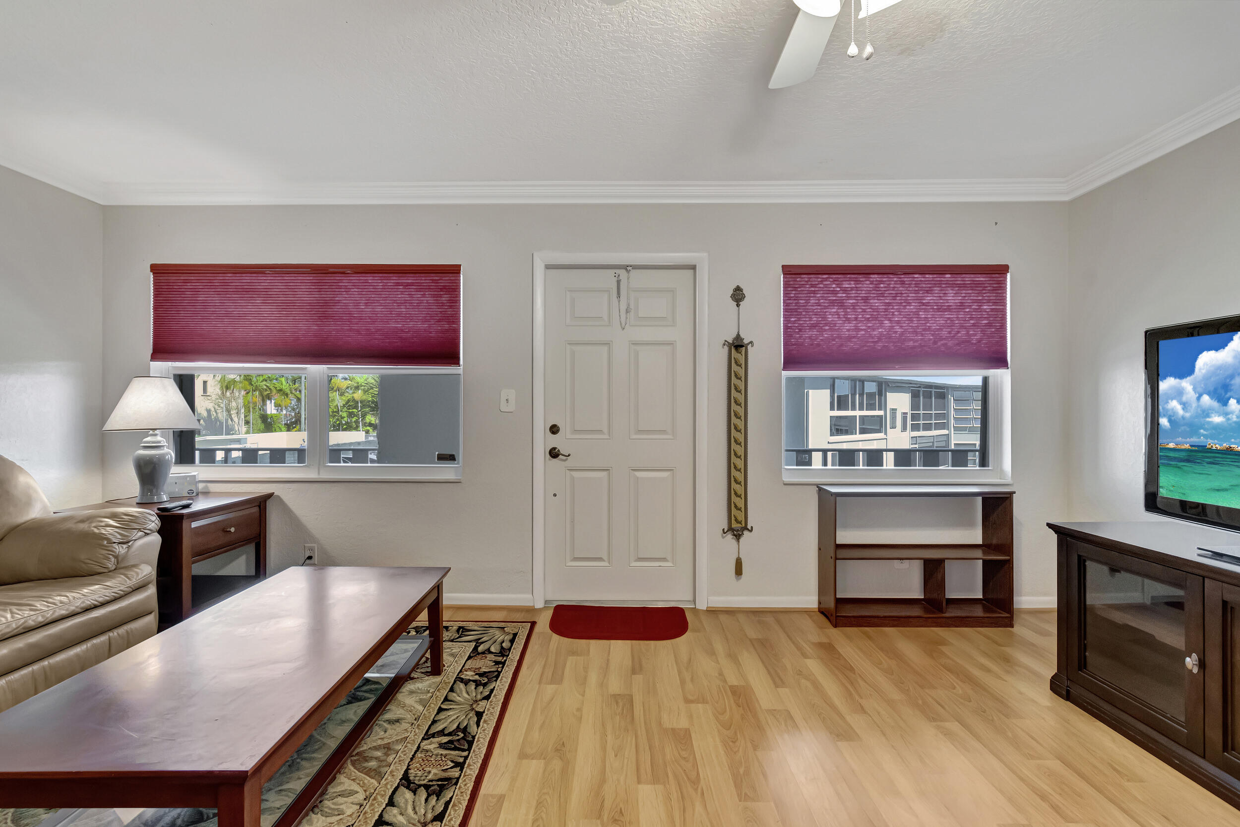 5540 North Ocean Boulevard, Unit 204 Ocean Ridge, FL 33435 - Photo 6 of 52 a bedroom with furniture and a wooden floor