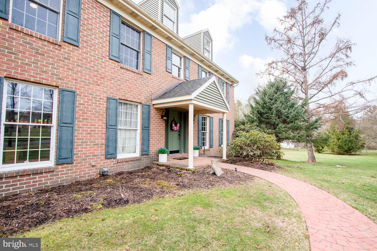115 Heiskel Drive Port Matilda, PA 16870 - Photo 7 of 66 Charming brick facade with inviting path.