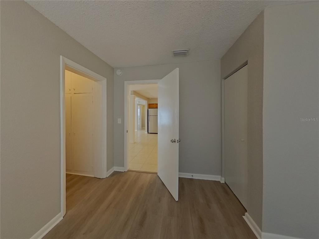 Undisclosed Address Clearwater, FL 33755 - Photo 12 of 22 a view of an empty room with wooden floor and closet