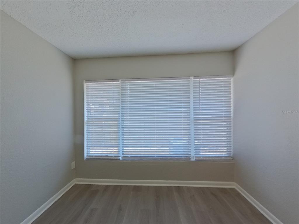 Undisclosed Address Clearwater, FL 33755 - Photo 13 of 22 a view of empty room with wooden floor