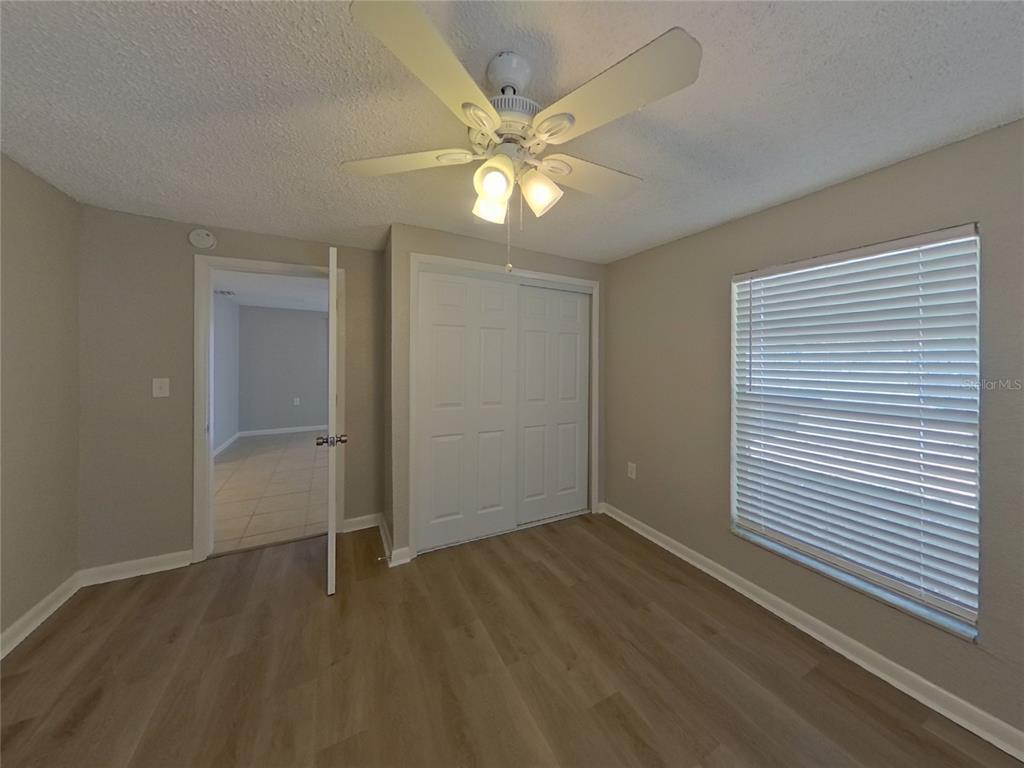 Undisclosed Address Clearwater, FL 33755 - Photo 19 of 22 wooden floor in an empty room with a window