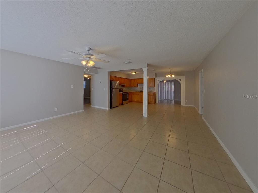 Undisclosed Address Clearwater, FL 33755 - Photo 3 of 22 a view of a livingroom with a staircase