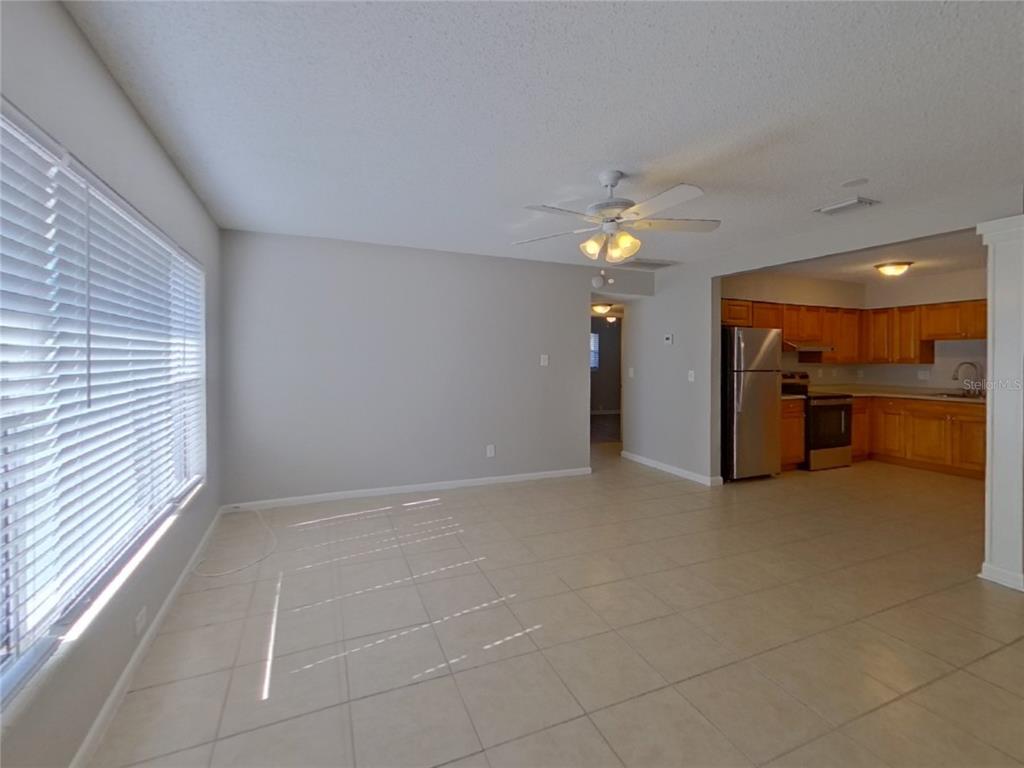 Undisclosed Address Clearwater, FL 33755 - Photo 4 of 22 a view of a livingroom with a ceiling fan and window