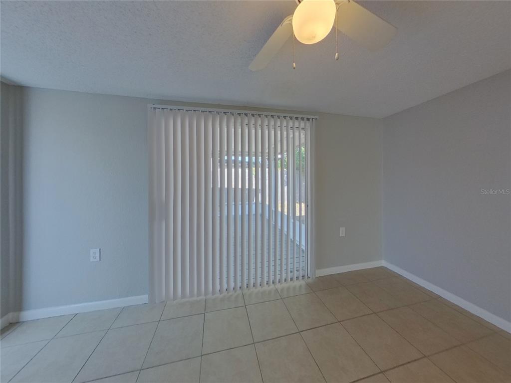 Undisclosed Address Clearwater, FL 33755 - Photo 5 of 22 a view of an empty room with a window