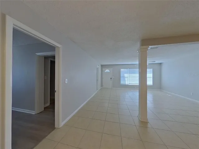 a view of an empty room and window
