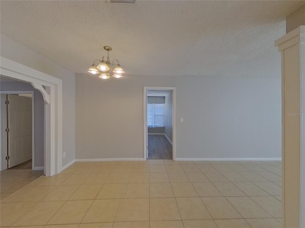 Undisclosed Address Clearwater, FL 33755 - Photo 9 of 22 a view of a chandelier in big room and a bathroom