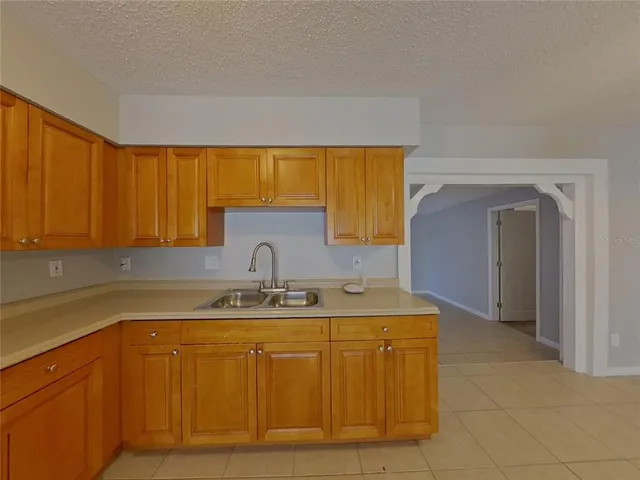a kitchen with a sink and cabinets