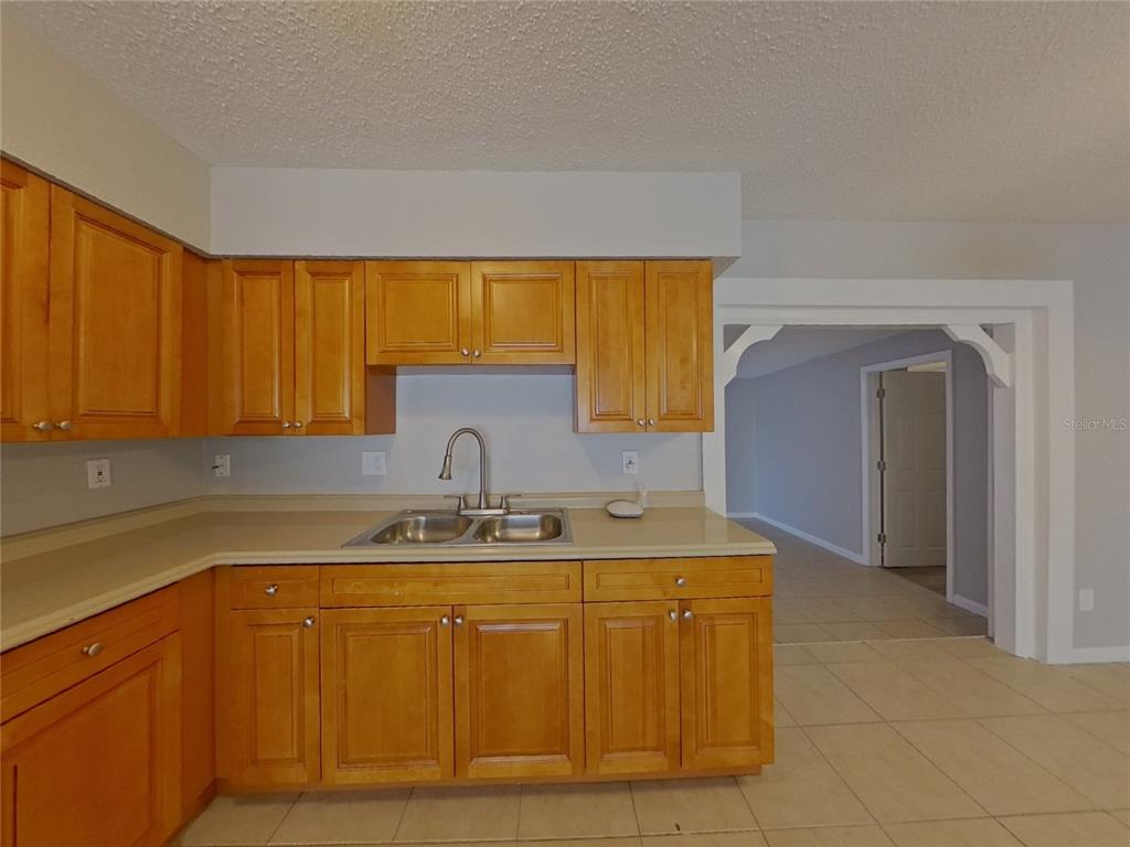 Undisclosed Address Clearwater, FL 33755 - Photo 10 of 22 a kitchen with a sink and cabinets