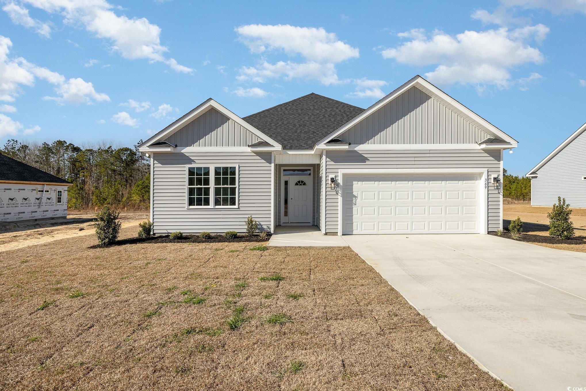 369 Log Cabin Road Loris, SC 29569 - Photo 2 of 30 View of front facade featuring a garage