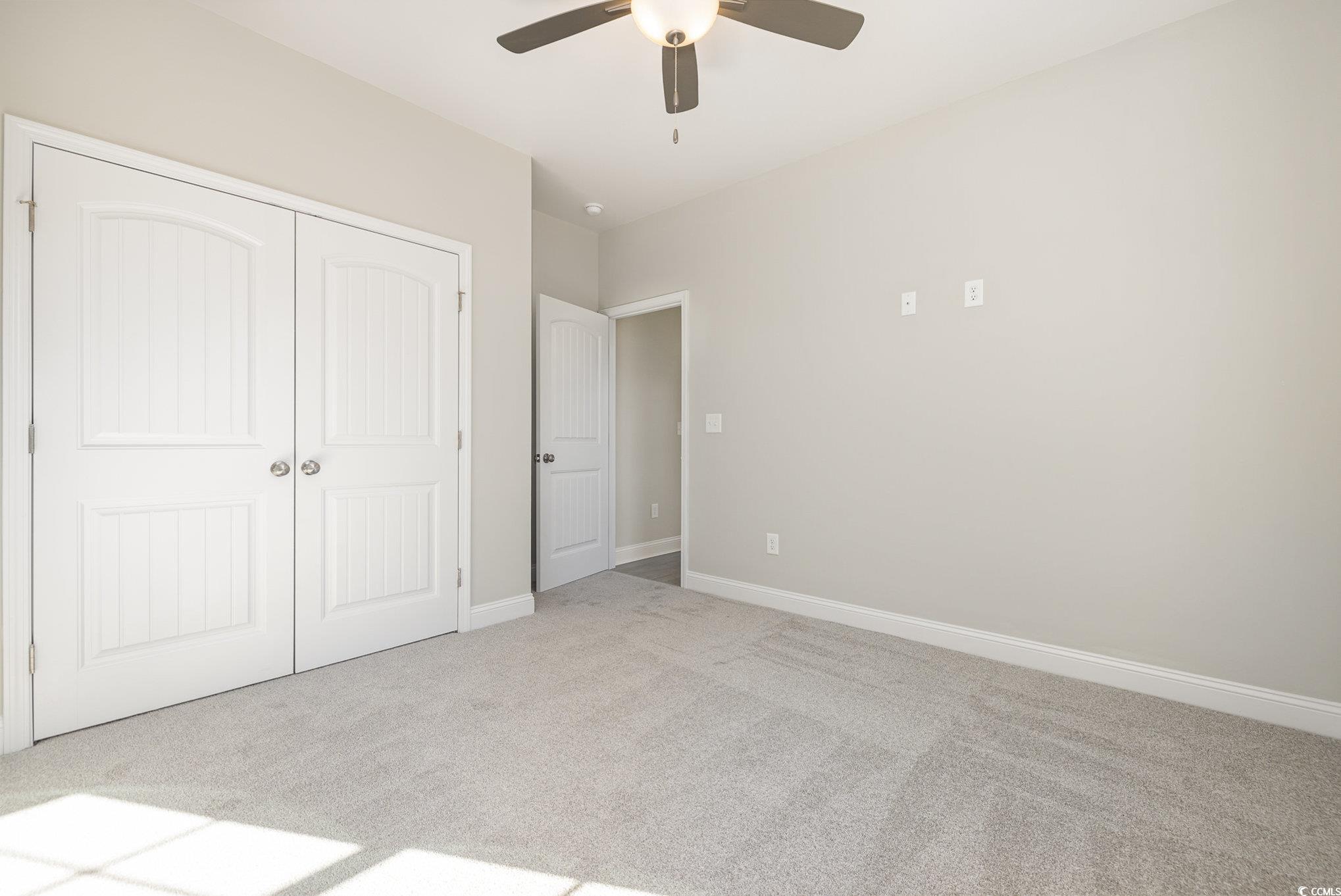 369 Log Cabin Road Loris, SC 29569 - Photo 24 of 30 Unfurnished bedroom featuring a closet, ceiling fa