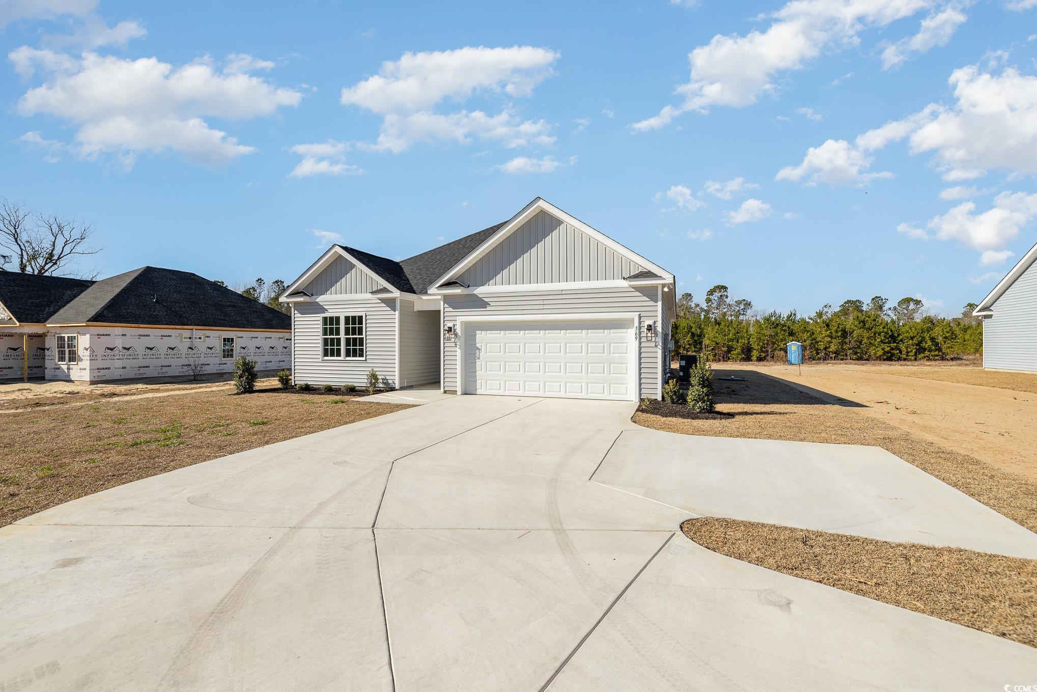 369 Log Cabin Road Loris, SC 29569 - Photo 4 of 30 View of front of home featuring a garage