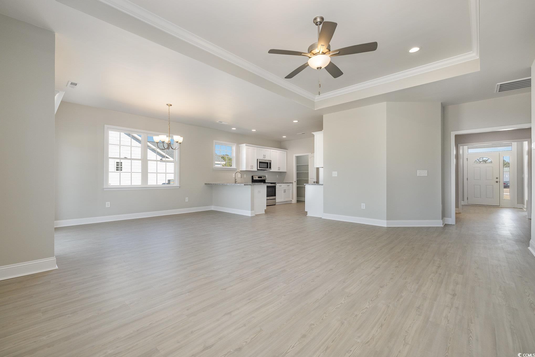 369 Log Cabin Road Loris, SC 29569 - Photo 8 of 30 Unfurnished living room with sink, a raised ceilin