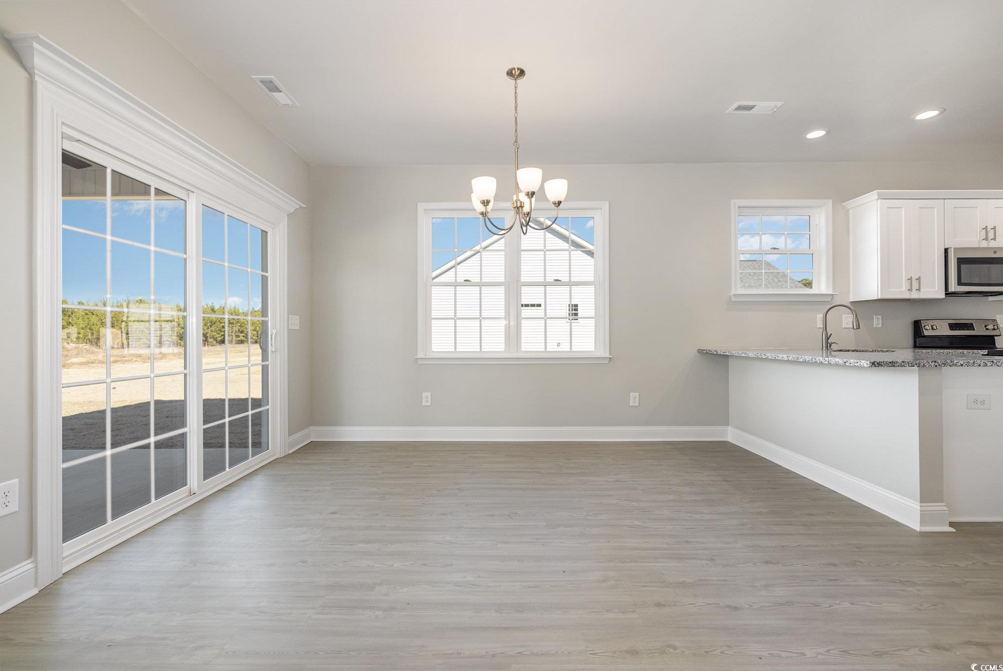369 Log Cabin Road Loris, SC 29569 - Photo 10 of 30 Kitchen featuring light stone counters, stainless