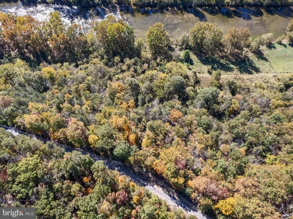 a sign broad in front of the red brick house