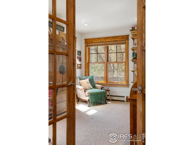 a view of a hallway with living room and furniture