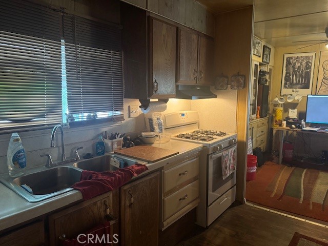 10550 Western Avenue, Unit 3 Stanton, CA 90680 - Photo 6 of 7 a kitchen with a sink a stove cabinets and a window