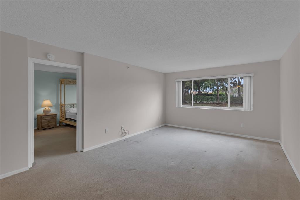 9599 Weldon Circle, Unit 103A Tamarac, FL 33321 - Photo 12 of 26 a view of a room with a large window