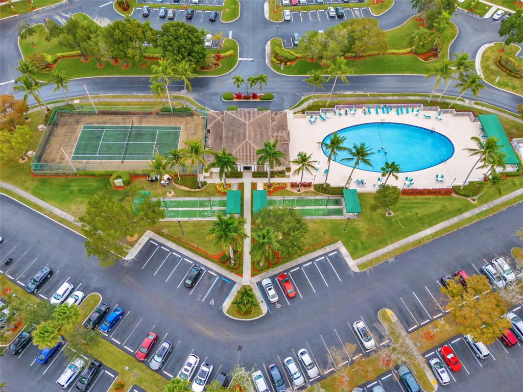 9599 Weldon Circle, Unit 103A Tamarac, FL 33321 - Photo 26 of 26 swimming pool view with sitting space and garden view