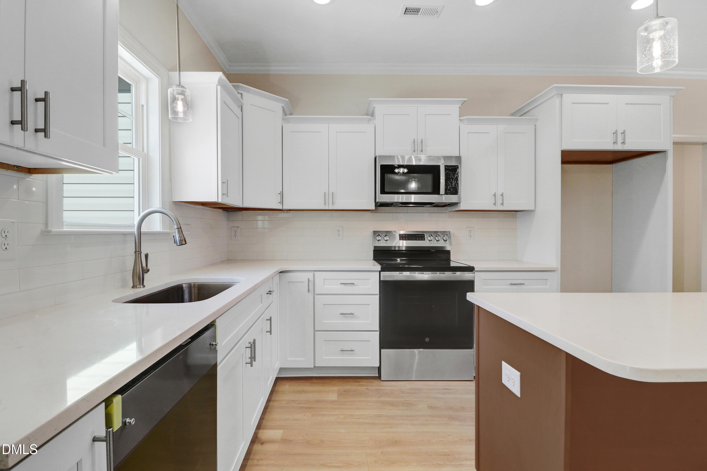 110 Rae Drive Pikeville, NC 27863 - Photo 14 of 35 a kitchen with stainless steel appliances granite countertop a sink stove and refrigerator