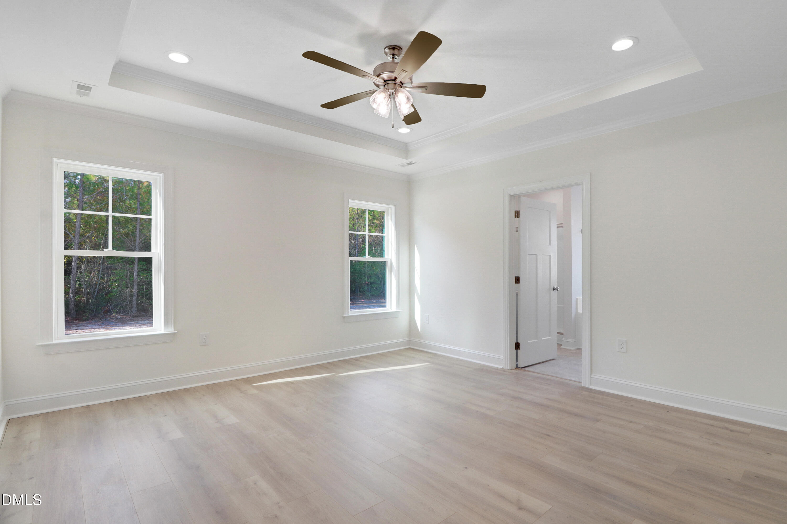 110 Rae Drive Pikeville, NC 27863 - Photo 19 of 35 an empty room with wooden floor and windows