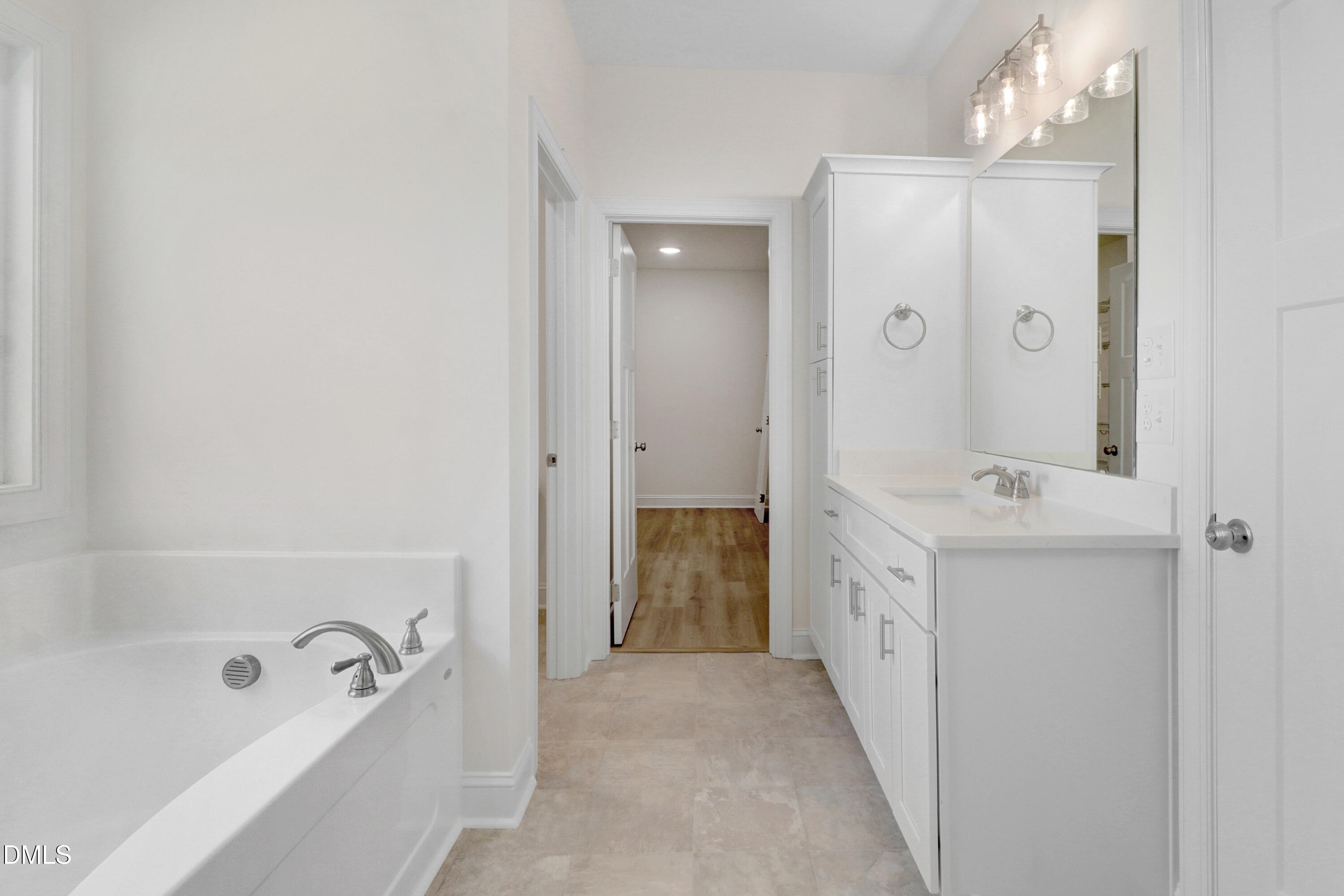 110 Rae Drive Pikeville, NC 27863 - Photo 21 of 35 a bathroom with a tub sink and mirror