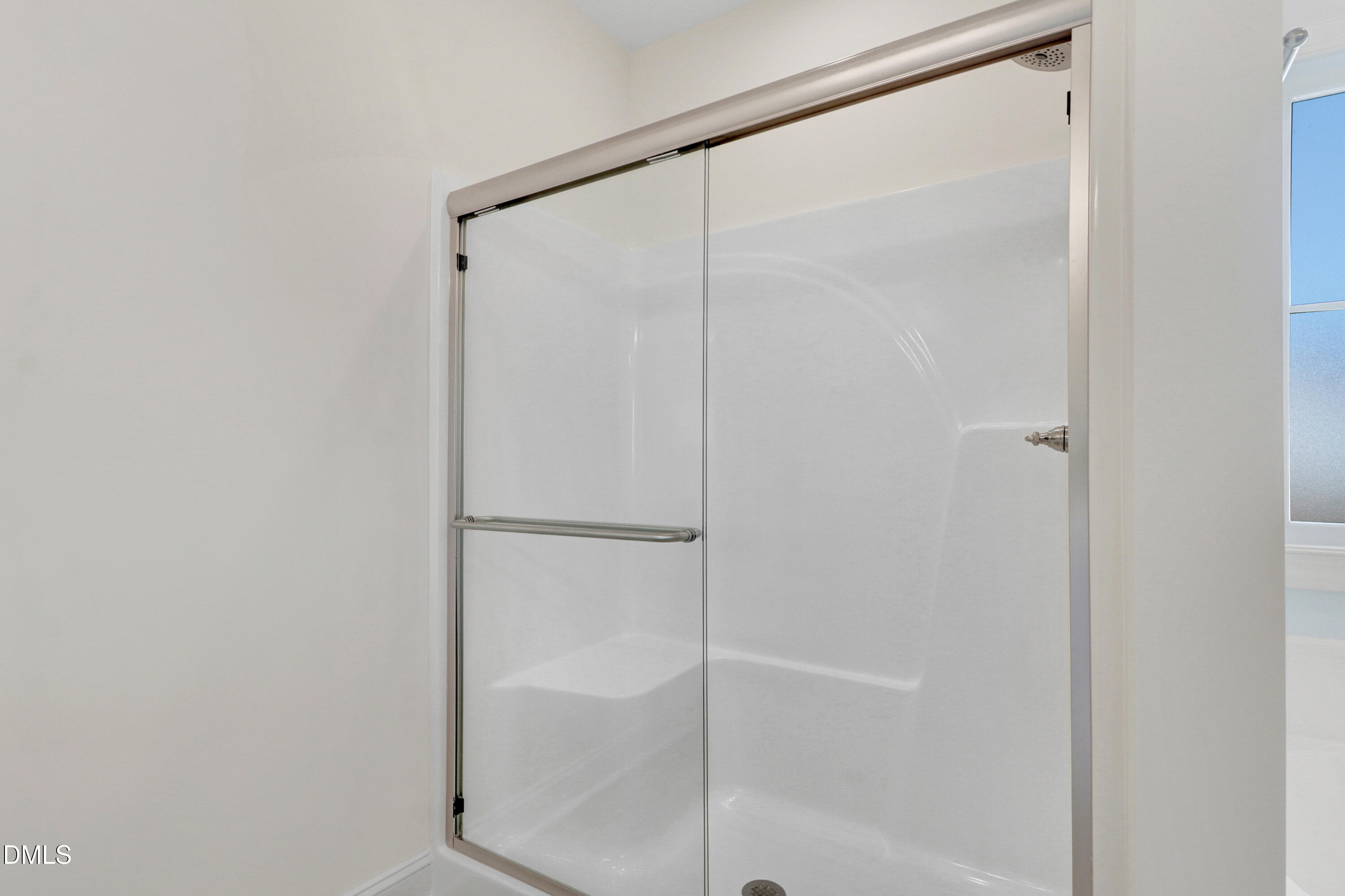 110 Rae Drive Pikeville, NC 27863 - Photo 24 of 35 a bathroom with a glass shower door