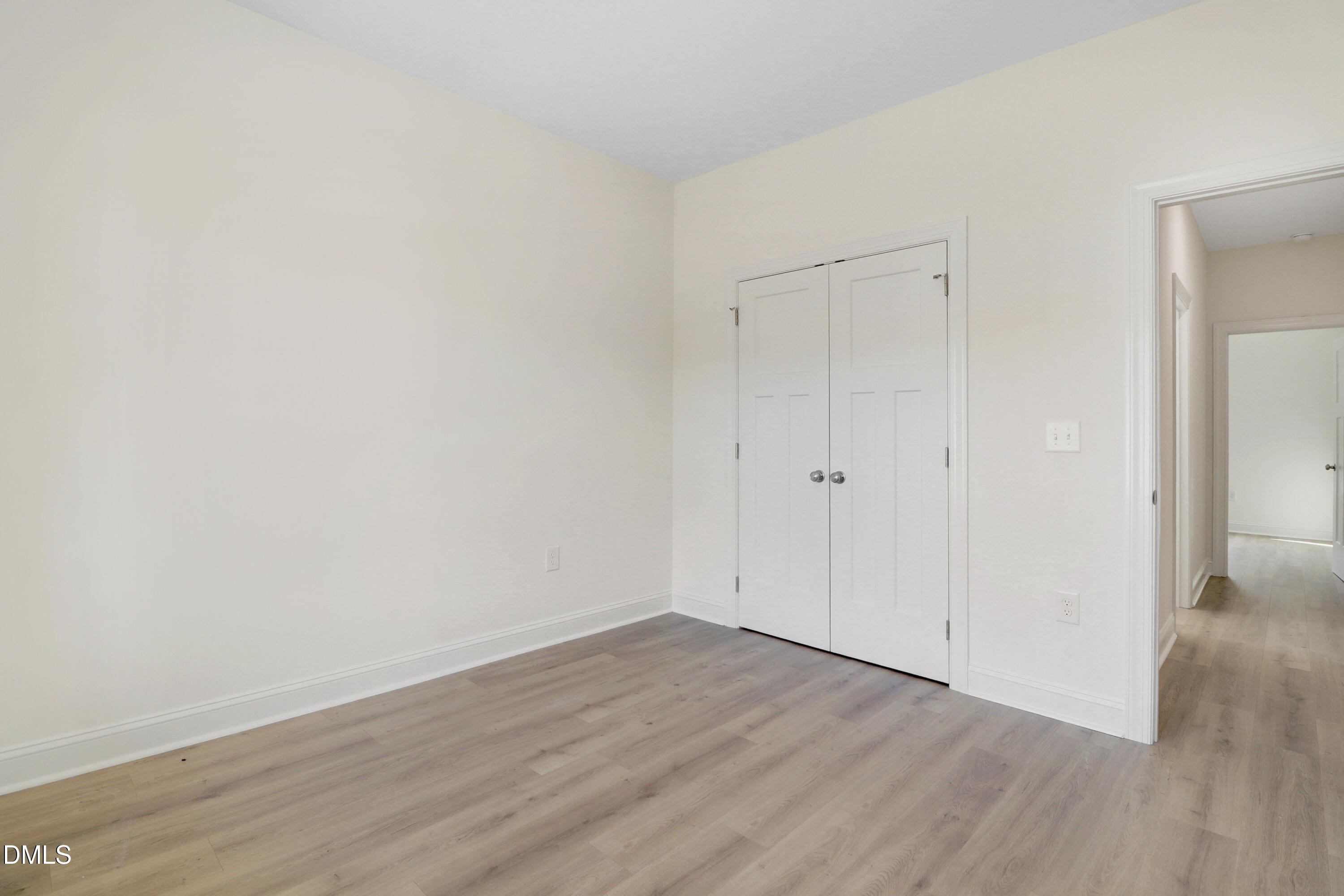 110 Rae Drive Pikeville, NC 27863 - Photo 26 of 35 a view of an empty room with wooden floor