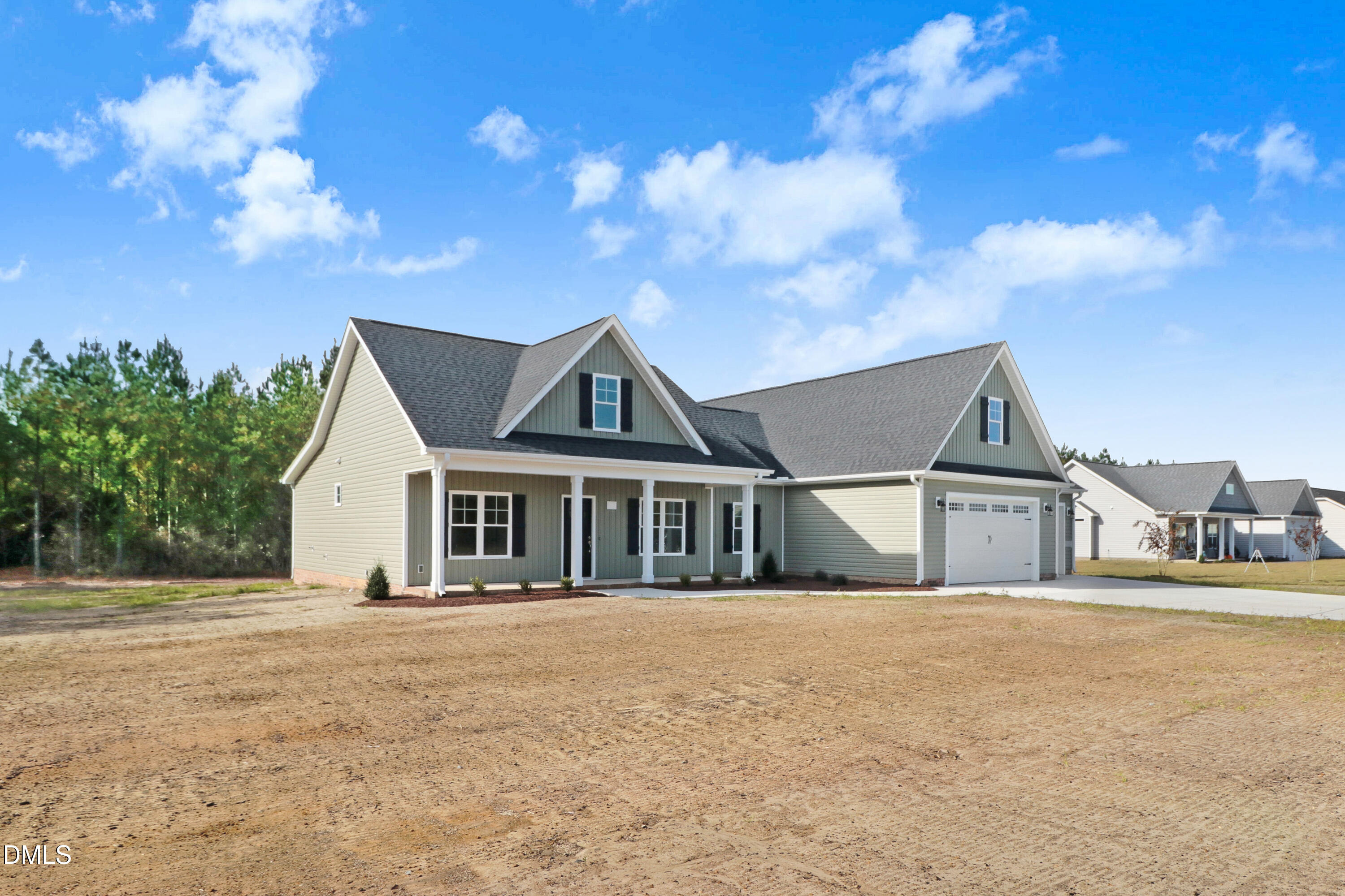 110 Rae Drive Pikeville, NC 27863 - Photo 3 of 35 a front view of a house with a garden