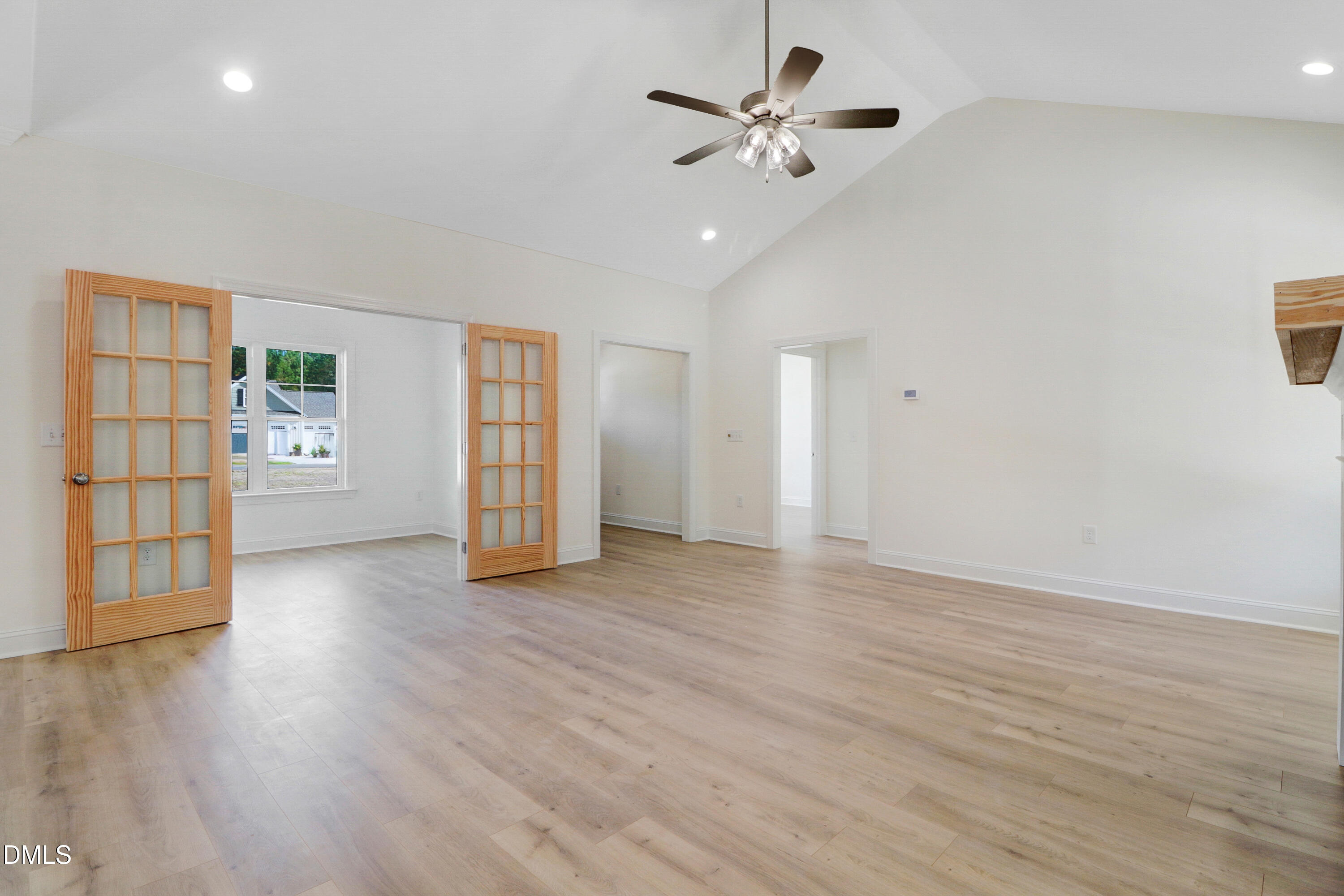 110 Rae Drive Pikeville, NC 27863 - Photo 9 of 35 a view of an empty room with a window and wooden floor
