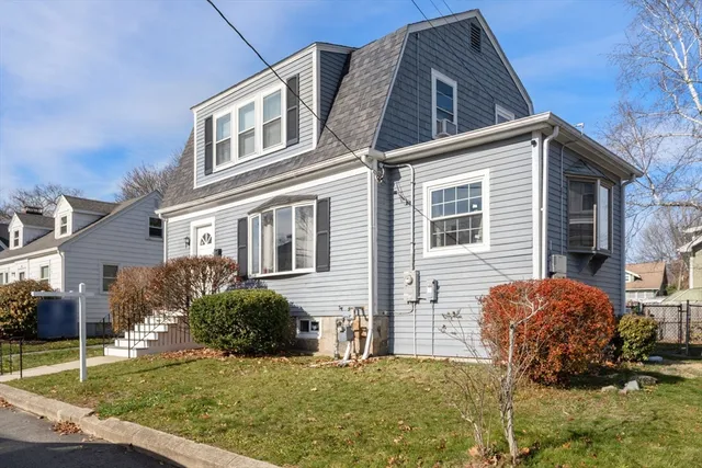a view of a house with a yard