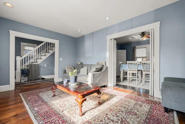 a living room with furniture and a rug