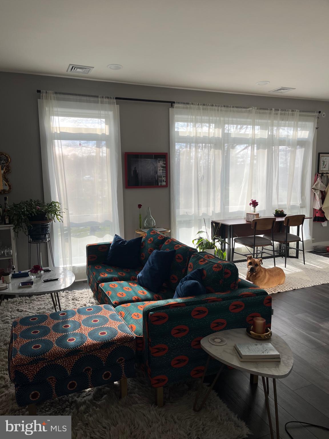 4001 Ridge Avenue Philadelphia, PA 19129 - Photo 11 of 26 a living room with furniture a large window and a dining table
