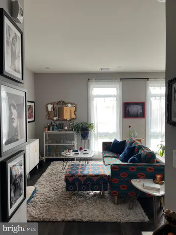 a bedroom with furniture and a flat screen tv