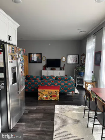 a bed room with a bed window and couch