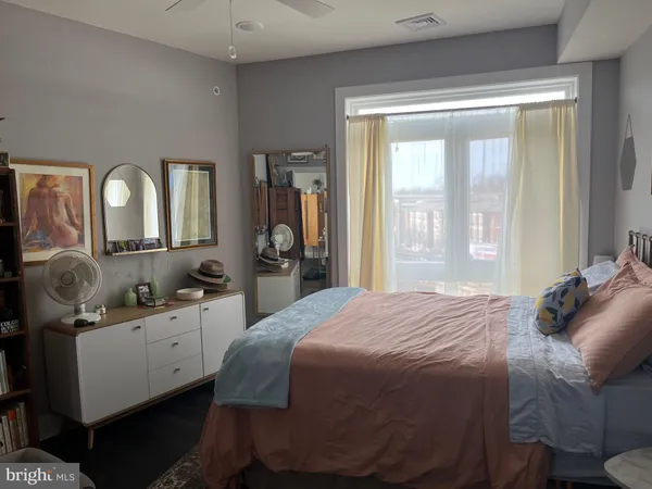 a bedroom with a bed and a walk in closet