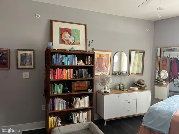 a view of a hallway with paintings on the wall