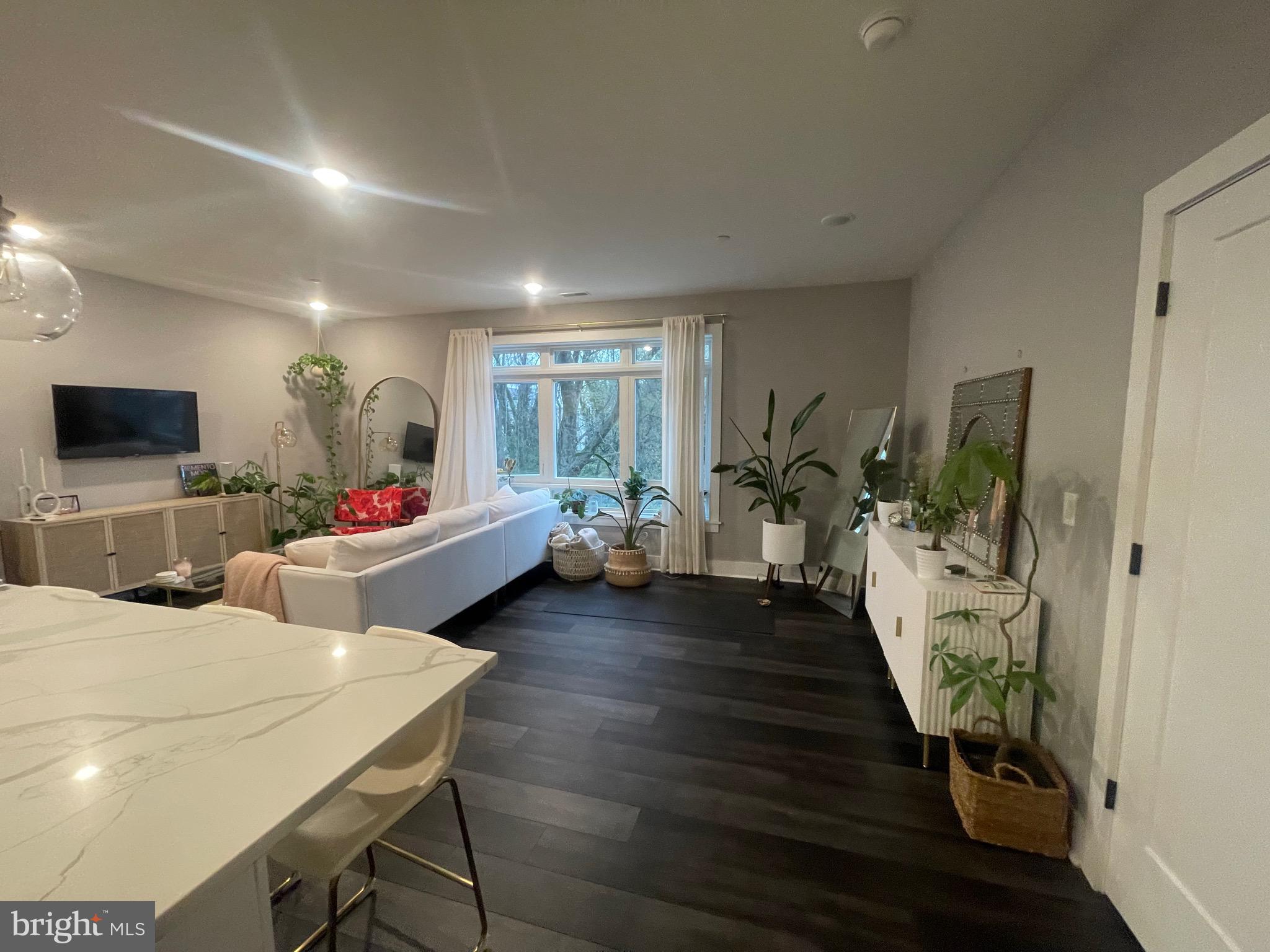 4001 Ridge Avenue Philadelphia, PA 19129 - Photo 6 of 26 a living room with furniture and a flat screen tv