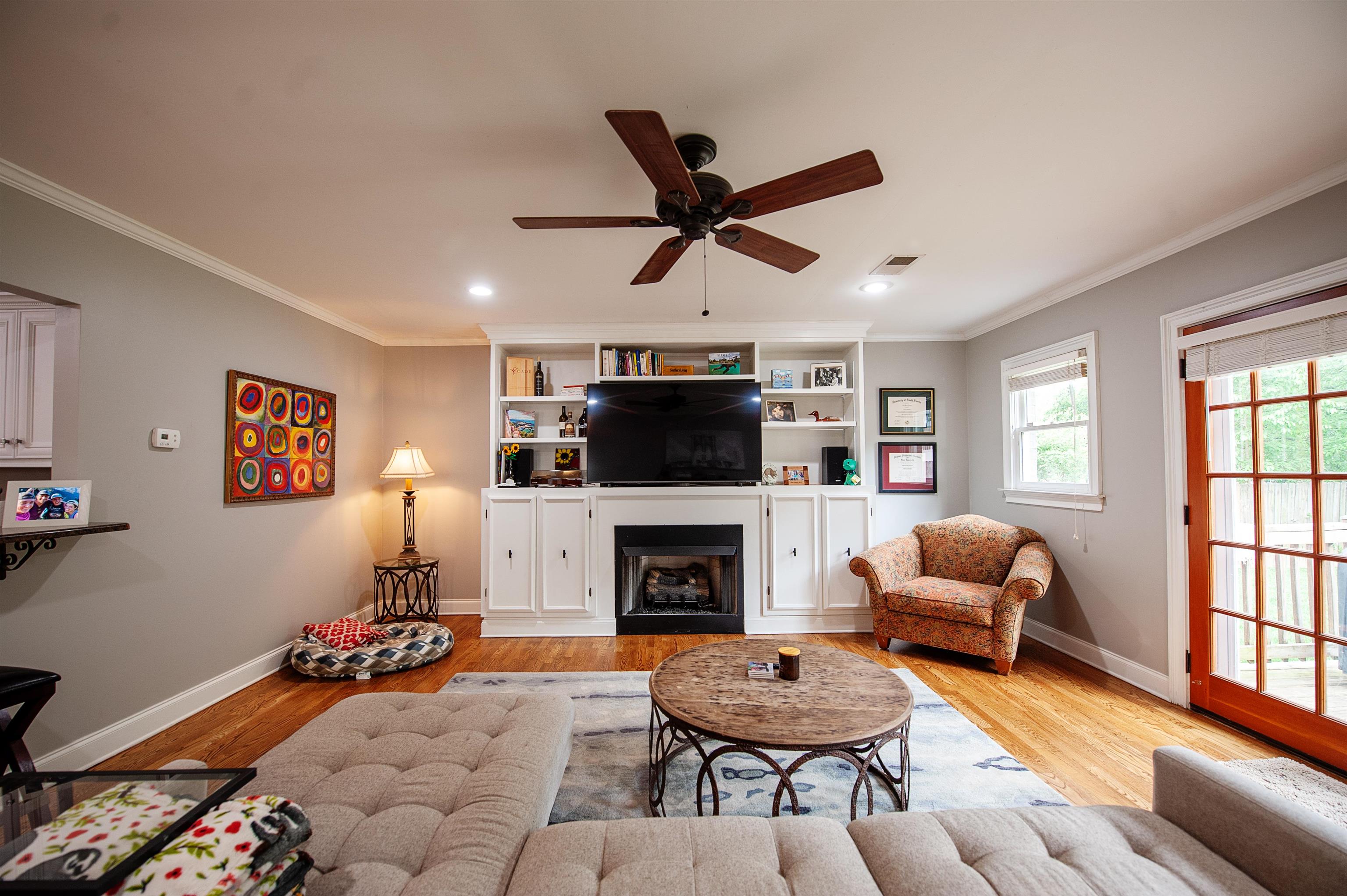 3640 Aurora Circle Memphis, TN 38111 - Photo 11 of 24 a living room with furniture a flat screen tv and a fireplace