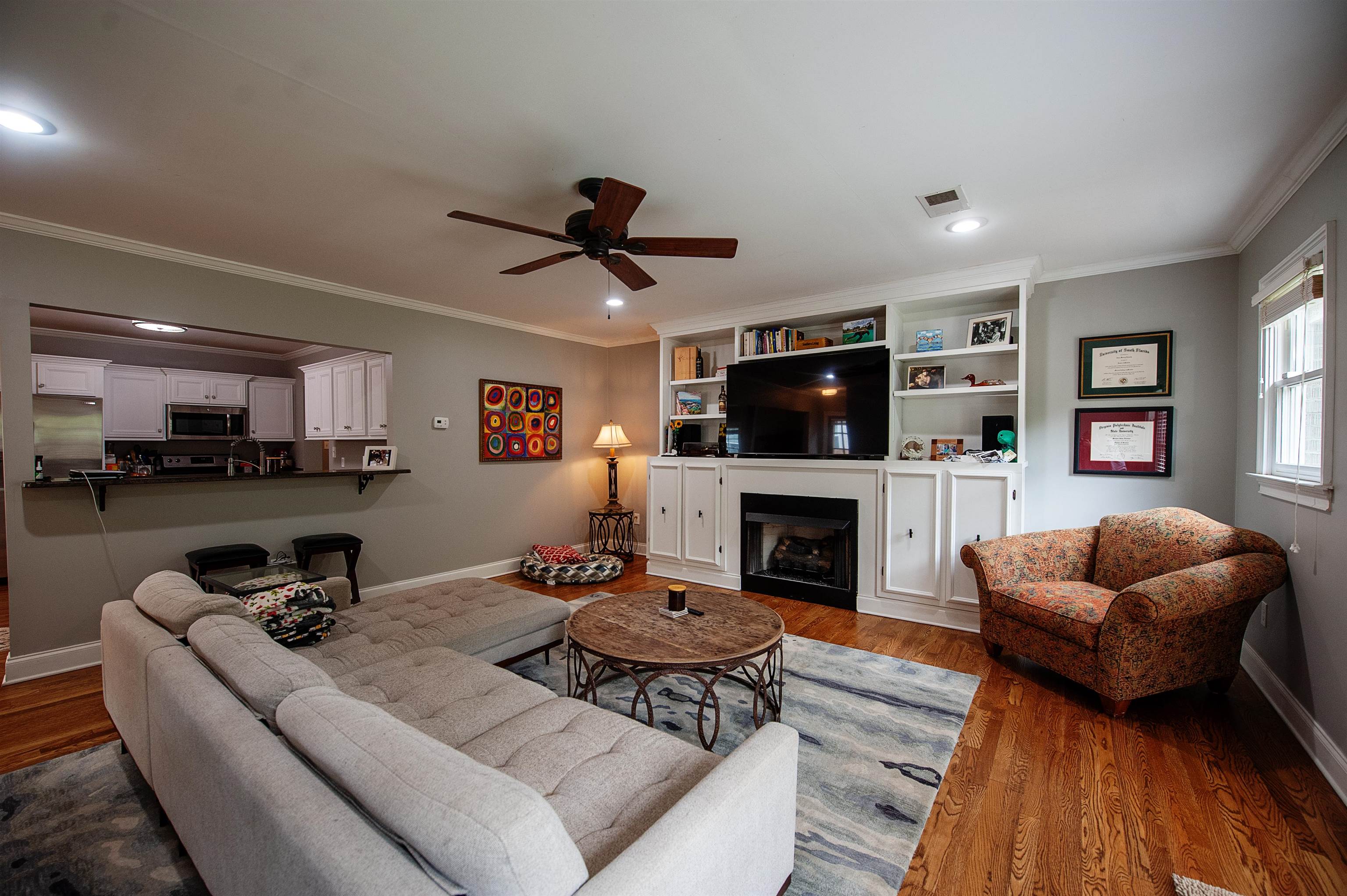 3640 Aurora Circle Memphis, TN 38111 - Photo 12 of 24 a living room with furniture a fireplace and a flat screen tv