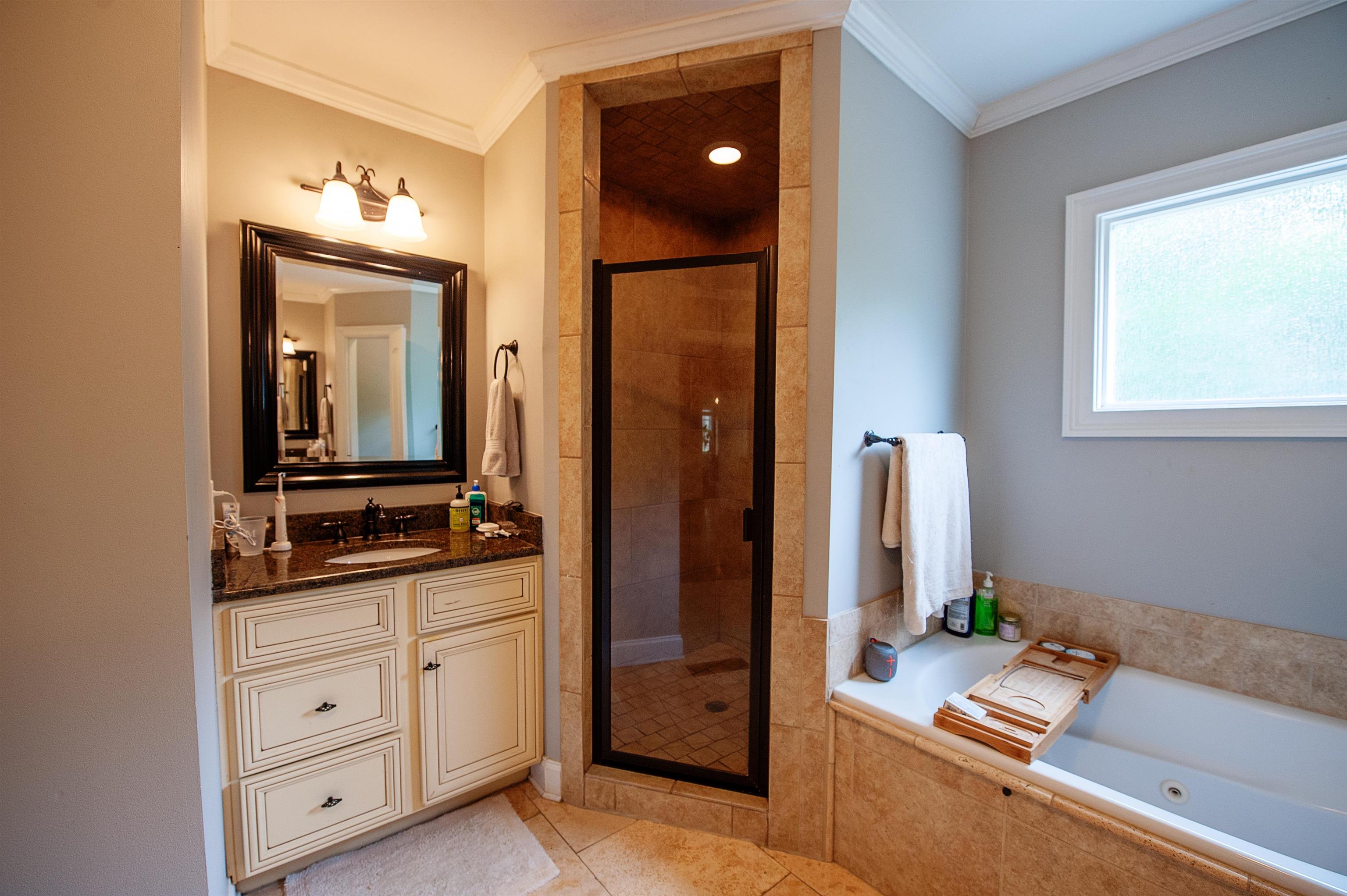 3640 Aurora Circle Memphis, TN 38111 - Photo 17 of 24 a bathroom with a double vanity sink and a mirror