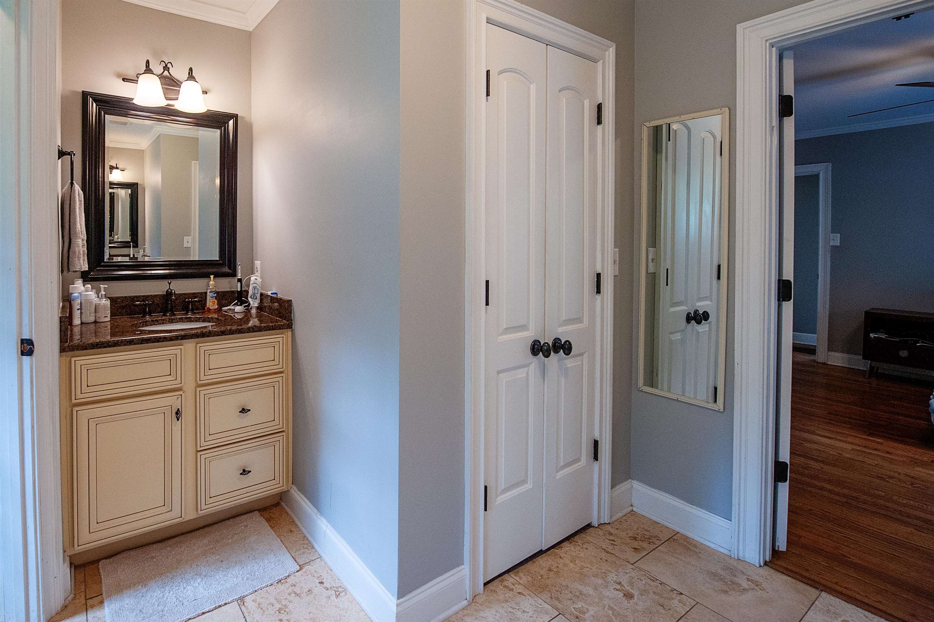 3640 Aurora Circle Memphis, TN 38111 - Photo 18 of 24 a bathroom with a double vanity sink and mirror