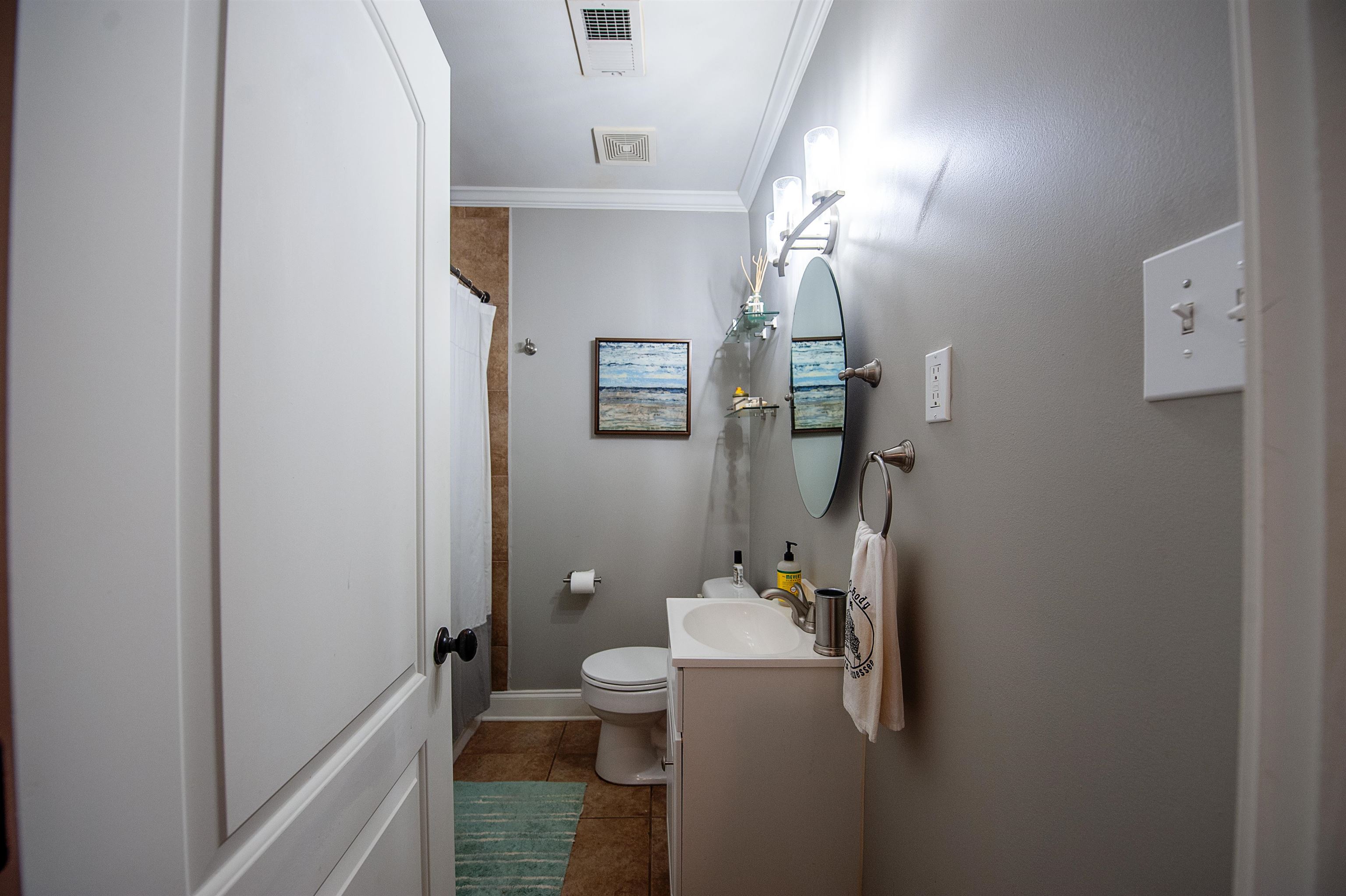 3640 Aurora Circle Memphis, TN 38111 - Photo 20 of 24 a bathroom with a granite countertop sink vanity mirror and toilet