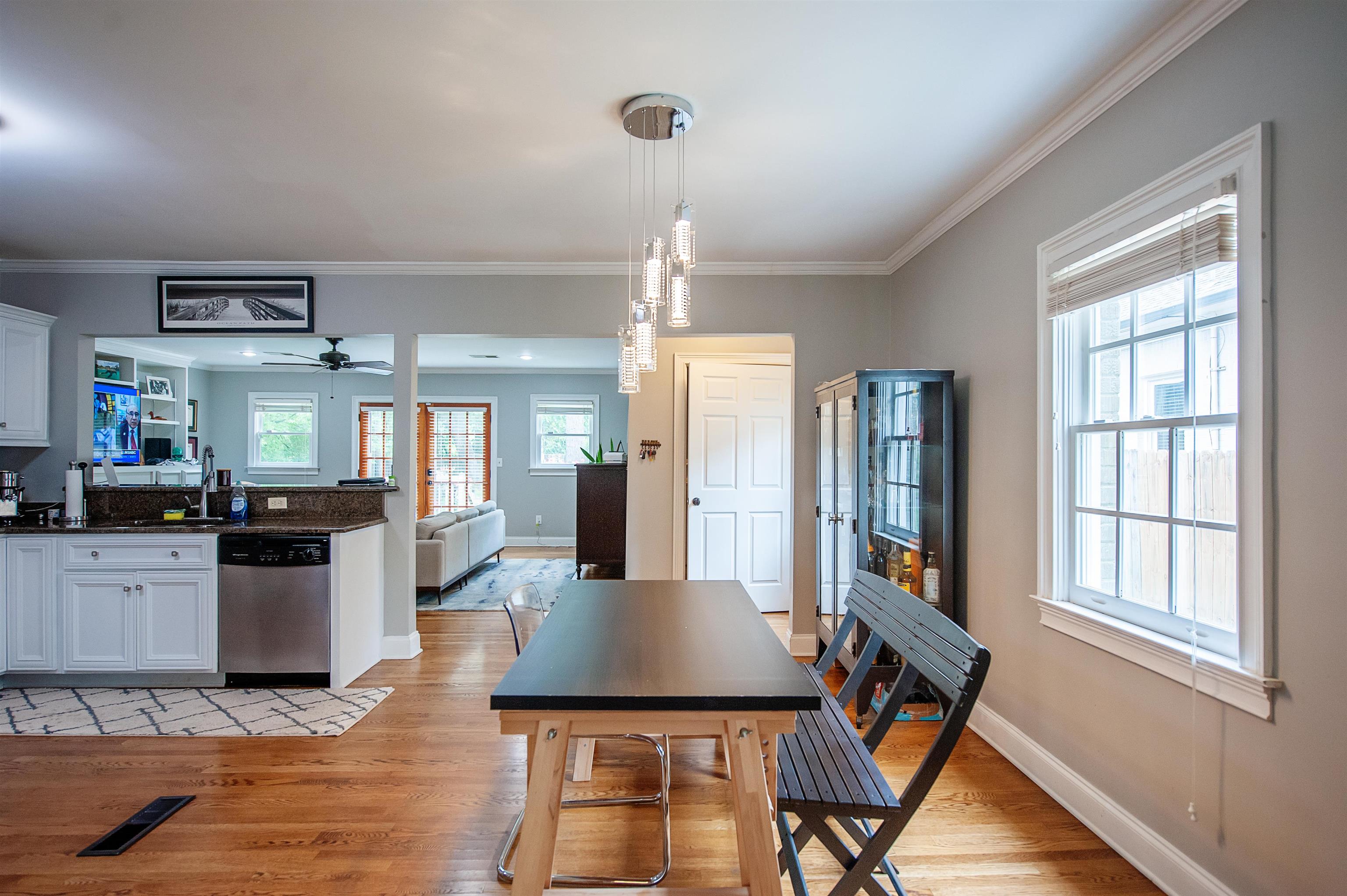3640 Aurora Circle Memphis, TN 38111 - Photo 6 of 24 a kitchen with a table chairs refrigerator and sink