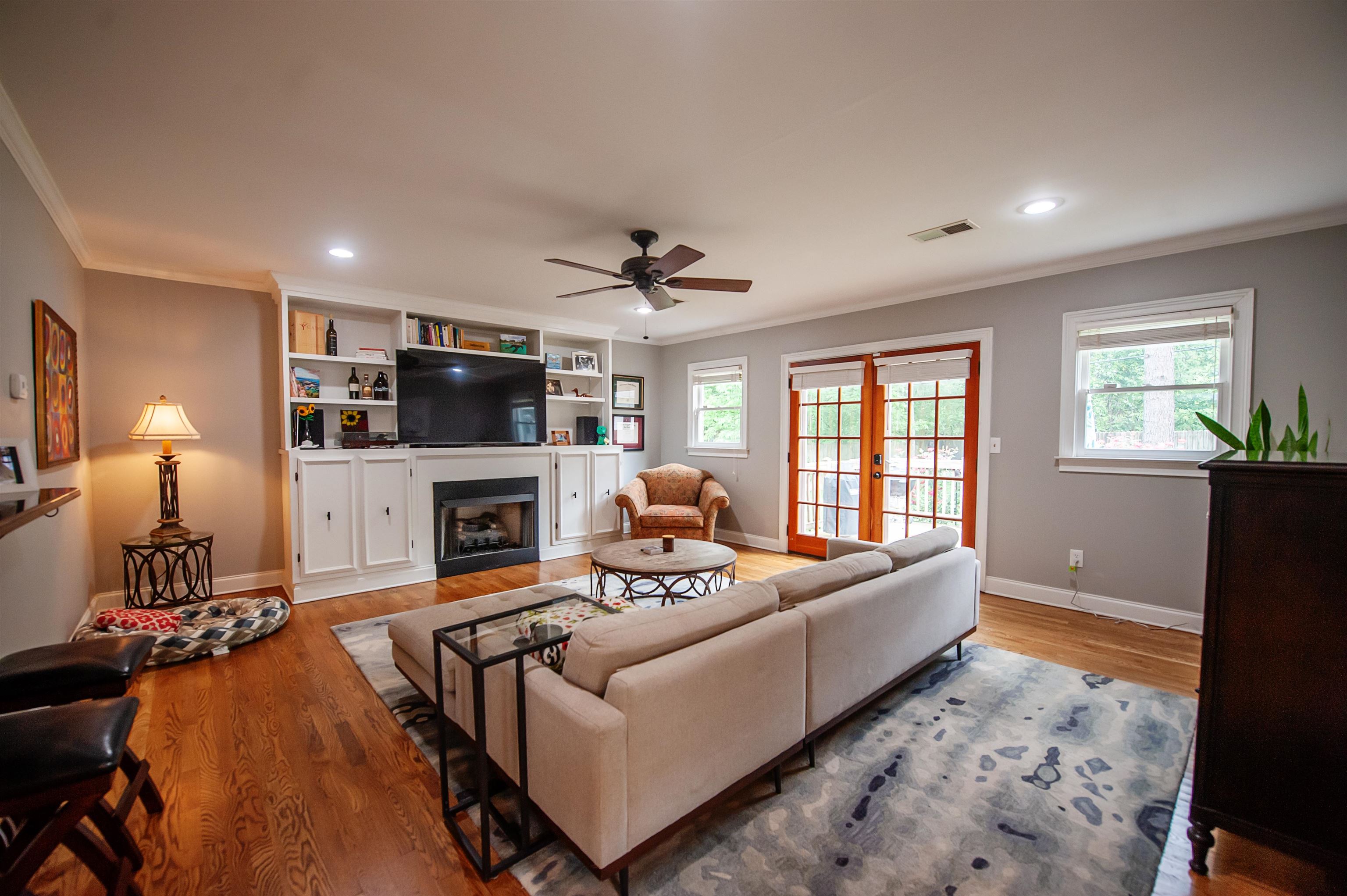 3640 Aurora Circle Memphis, TN 38111 - Photo 10 of 24 a living room with furniture a fireplace and a flat screen tv