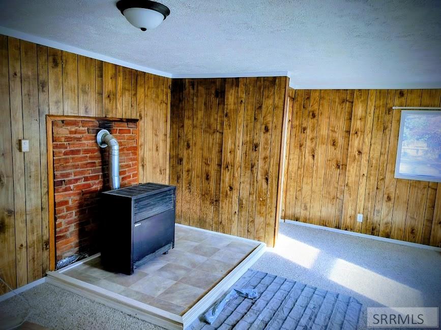 683 Decoria Avenue Arco, ID 83213 - Photo 6 of 23 den and dining with propane fireplace