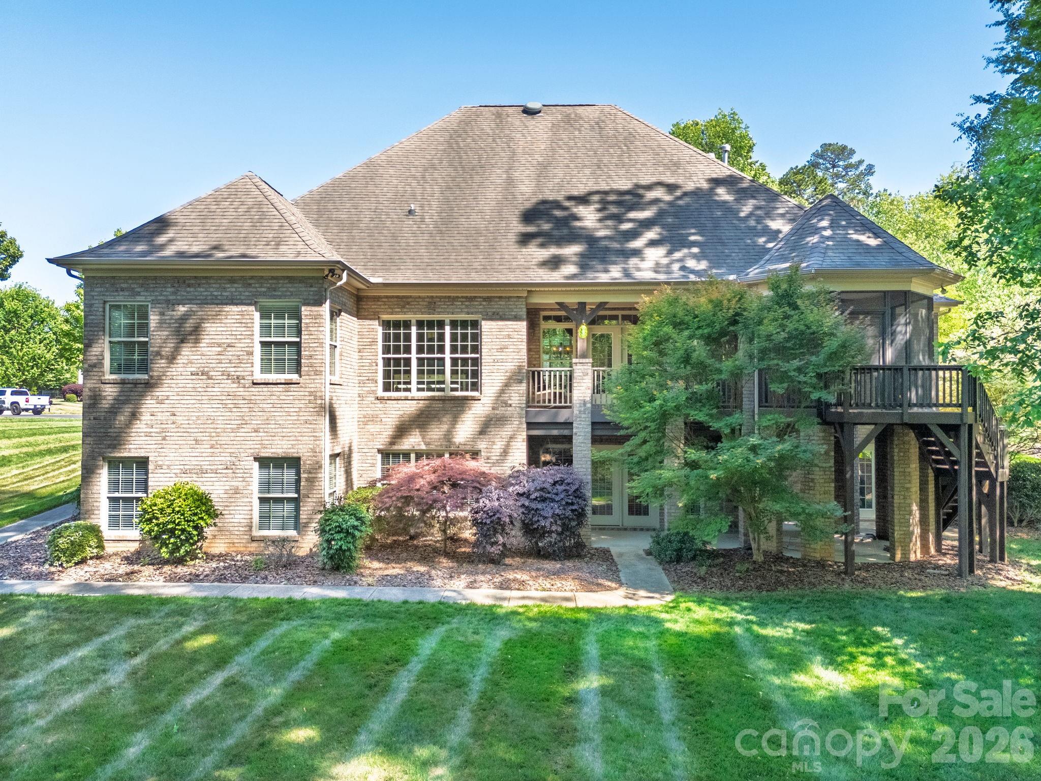 3138 Rappahannock Court, Unit 16 Matthews, NC 28104 - Photo 2 of 38 a front view of house with yard and green space