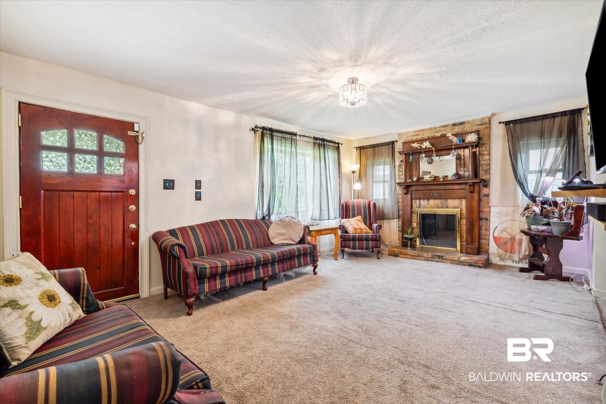 4851 Lesure Road Theodore, AL 36582 - Photo 21 of 21 Carpeted living room featuring a fireplace